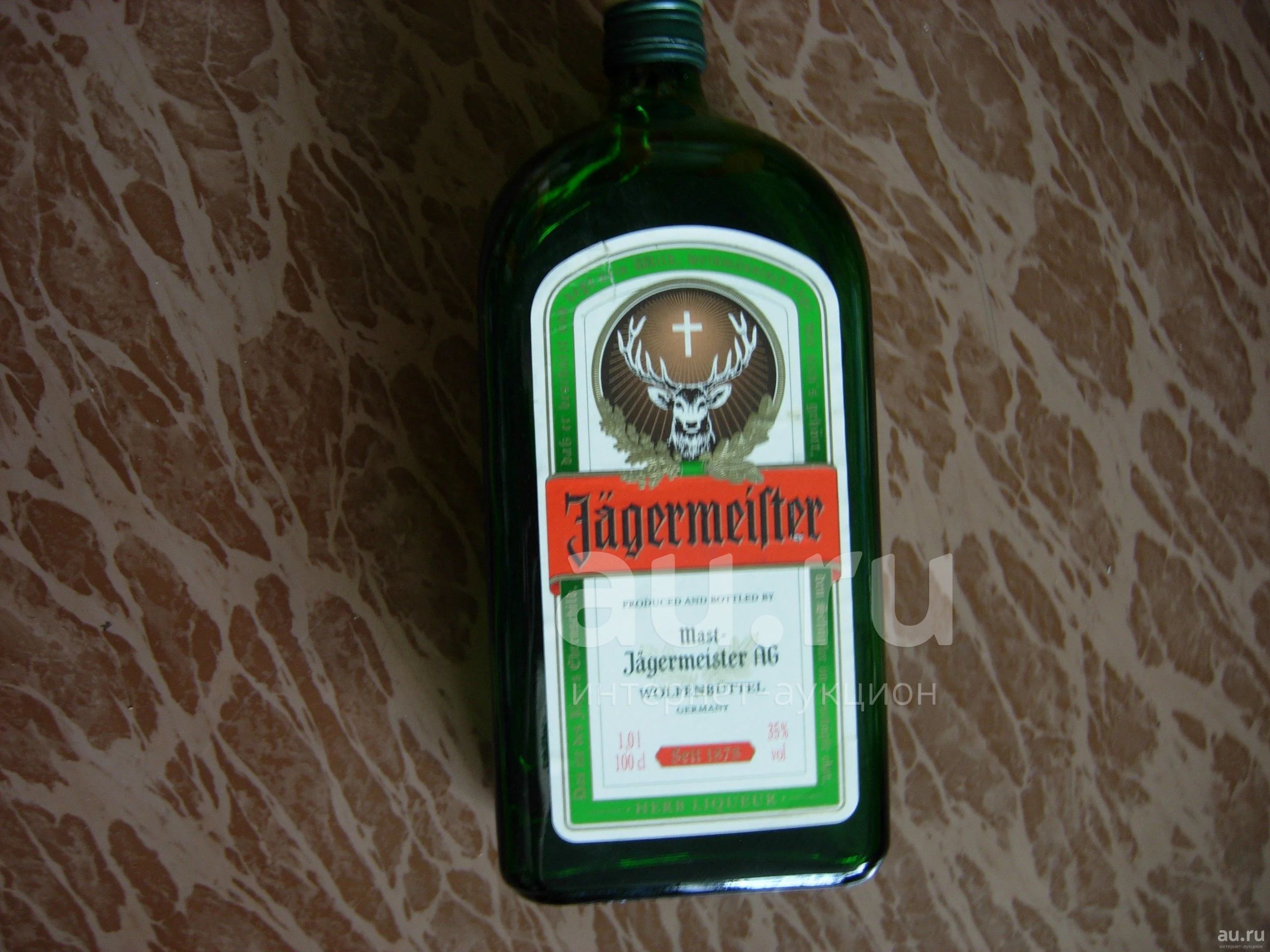 Цена ягермастера 0.7. Немецкий ликер с зеленой этикеткой. Бутылка пробка этикетка флагмана. Немецкие ликеры 90-х. Немецкий ликер с зайцем.