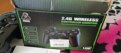 Лот: 25641786. Фото: 1. Игровая приставка Game Stick 4K... Игры для консолей
