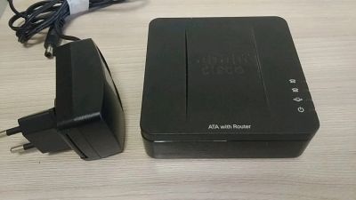 Лот: 13998506. Фото: 1. VoIP шлюз Cisco SPA122 with router. SIP, Видео-телефоны