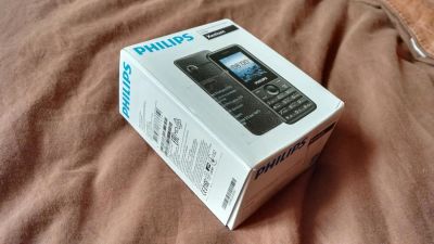 Лот: 9782986. Фото: 1. Сотовый телефон Philips E103. Кнопочные мобильные телефоны