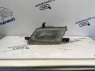 Лот: 21712670. Фото: 1. фара Nissan Wingroad Y11. Двигатель и элементы двигателя