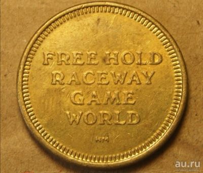 Лот: 18476250. Фото: 1. Жетон Free hold raceway game world. Другое (значки, медали, жетоны)