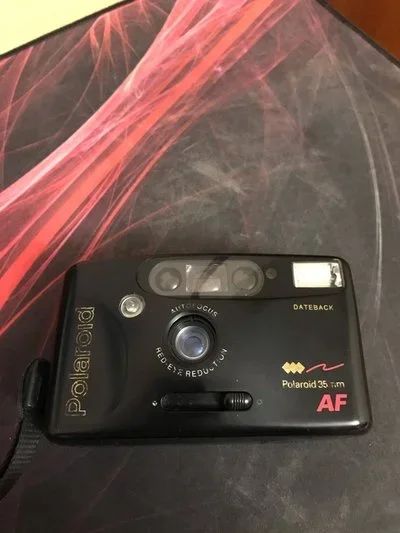Лот: 17109817. Фото: 1. Плёночный фотоаппарат Polaroid... Плёночные компактные