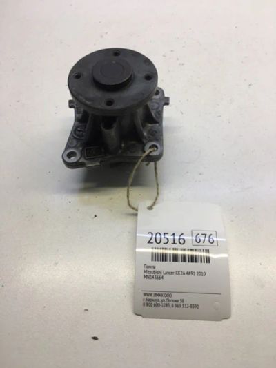 Лот: 20381143. Фото: 1. Помпа Mitsubishi Lancer 2010 MN143664... Двигатель и элементы двигателя