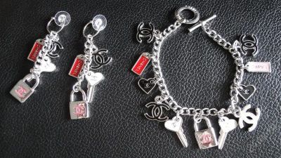 Лот: 1709370. Фото: 1. Набор Chanel "Замок" Браслет и... Серьги, каффы