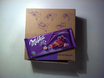 Лот: 3330826. Фото: 1. Шоколадки Milka с фундуком и изюмом... Шоколад, конфеты