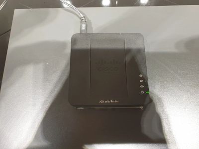 Лот: 16554345. Фото: 1. Cisco SPA122 VoIP шлюз (SIP шлюз... Маршрутизаторы (роутеры)
