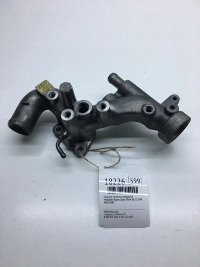 Лот: 20380192. Фото: 1. Патрубок системы охлаждения Mitsubishi... Двигатель и элементы двигателя
