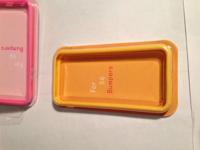 Лот: 3349710. Фото: 1. Бампер ораньжевый iphone 5,5s... Чехлы, бамперы
