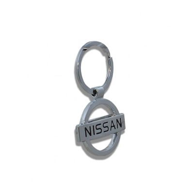 Лот: 20927127. Фото: 1. Брелок на ключ Nissan круг металл. Брелоки для ключей