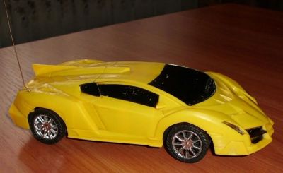 Лот: 10605213. Фото: 1. Машинка игрушка гоночная желтая... Машины и техника