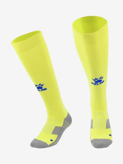 Лот: 22424062. Фото: 1. Kelme Гетры LIGA, Желтый. Другое (спортивная одежда)