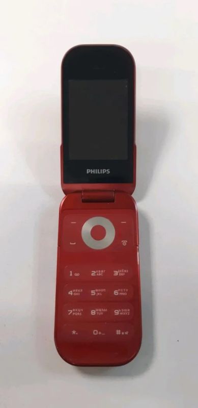 Лот: 6241898. Фото: 1. Сотовый телефон Philips e320... Кнопочные мобильные телефоны