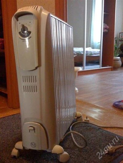 Лот: 1149550. Фото: 1. Масляный радиатор De'Longhi TRD... Обогреватели бытовые