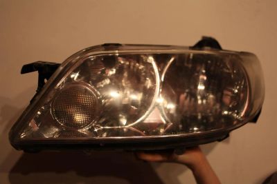 Лот: 3816318. Фото: 1. Фара для Mazda Familia левая B32E510L0. Оптика и освещение
