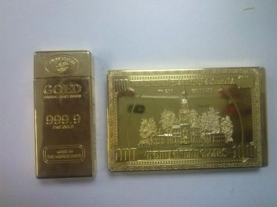 Лот: 6270771. Фото: 1. Зажигалки в виде слитка золота. Зажигалки, спички, пепельницы