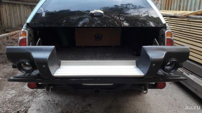 Лот: 13777393. Фото: 1. Бампер задний Mitsubishi L200. Кузов