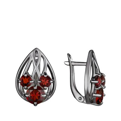 Лот: 23815683. Фото: 1. Серебряные серьги с гранатом и... Серьги, каффы