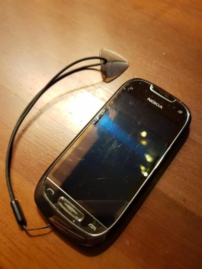 Лот: 10848861. Фото: 1. Nokia C7-00. Застряла сим-карта... Смартфоны
