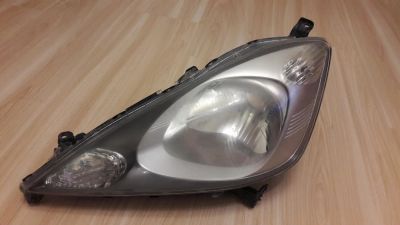Лот: 10591757. Фото: 1. Левая фара Honda Fit 2009 (оригинальная... Электроприборы для автомобиля