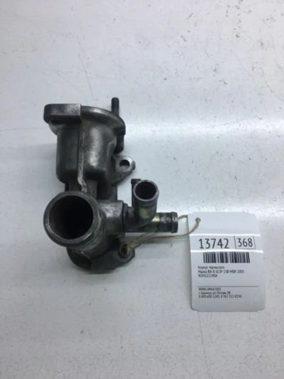 Лот: 20378275. Фото: 1. Корпус термостата Mazda Rx-8 2003... Двигатель и элементы двигателя
