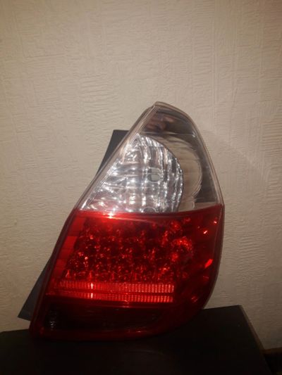 Лот: 13250671. Фото: 1. Фара-Стоп правая Honda Fit кузов... Оптика и освещение