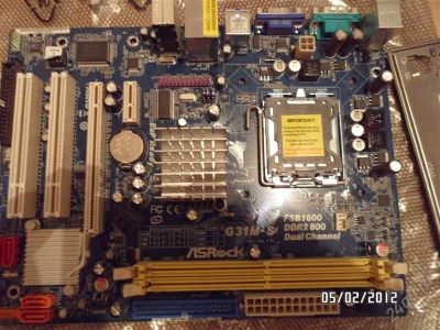 Лот: 1541875. Фото: 1. Материнская плата ASRock G31M-S... Материнские платы