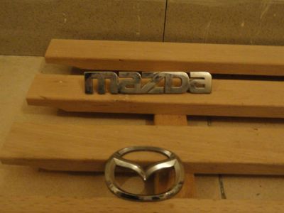 Лот: 3118049. Фото: 1. Значок на дверь от mazda familia... Другое (автозапчасти)