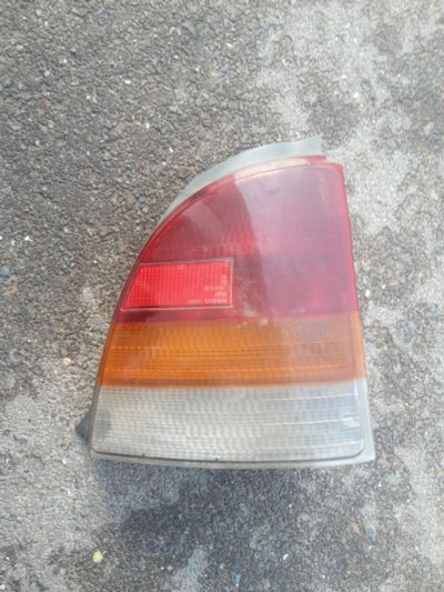 Лот: 7673501. Фото: 1. фонарь задний левый Toyota Starlet. Оптика и освещение