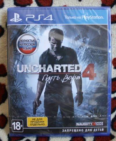 Лот: 13276516. Фото: 1. Uncharted 4 (в плёнке). Игры для консолей