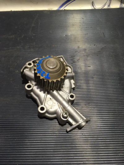 Лот: 21717672. Фото: 1. помпа водяная Chevrolet Aveo T250. Двигатель и элементы двигателя