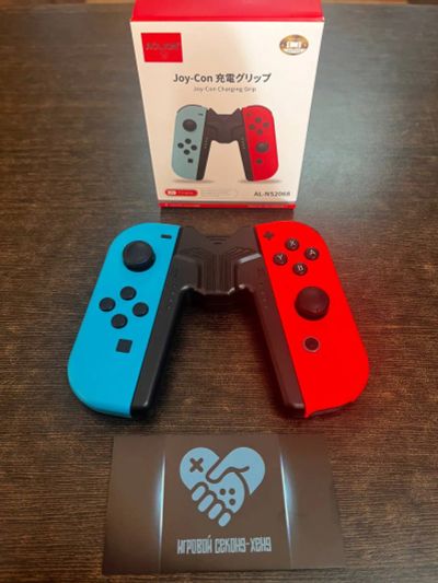 Лот: 19561977. Фото: 1. Держатель Grip для JoyCon от Nintendo... Аксессуары для игровых приставок, консолей, геймпады