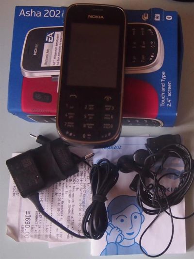 Лот: 3357481. Фото: 1. Nokia Asha 202 (2 сим карты). Кнопочные мобильные телефоны