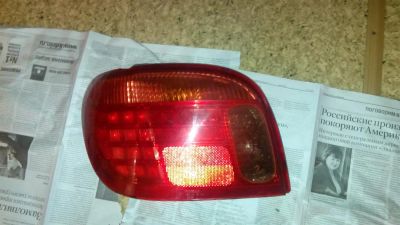 Лот: 3716433. Фото: 1. Левый задний фонарь Toyota Vitz... Оптика и освещение