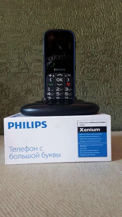 Лот: 6468489. Фото: 1. Сотовый телефон Philips xenium... Кнопочные мобильные телефоны