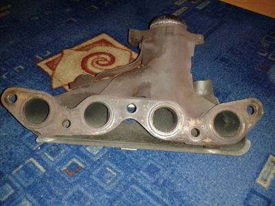 Лот: 4998000. Фото: 1. коллектор выпускной. Двигатель и элементы двигателя