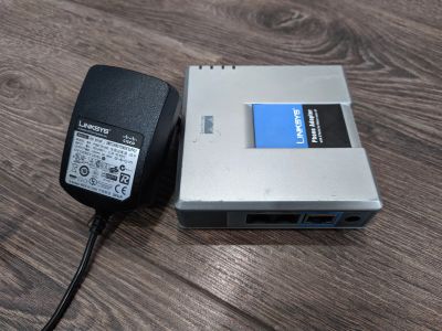 Лот: 15853451. Фото: 1. Voip-шлюз Linksys pap2t. Маршрутизаторы (роутеры)