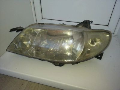 Лот: 6876328. Фото: 1. Фара левая Mazda Familia. Оптика и освещение