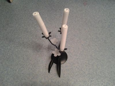 Лот: 3428591. Фото: 1. Свеча с чугунным подсвечником. Свечи