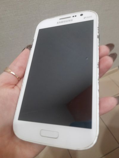 Лот: 18952487. Фото: 1. Телефон Samsung GT-i9060 белый. Смартфоны