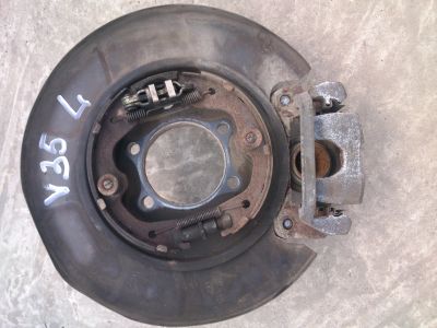 Лот: 11836789. Фото: 1. Суппорт задний левый Nissan Stagea... Тормозная система