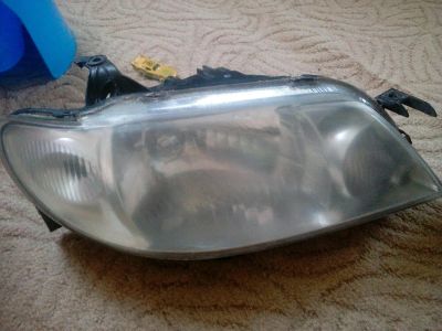 Лот: 9374638. Фото: 1. Фара на Mazda Familia 01-04 г... Оптика и освещение