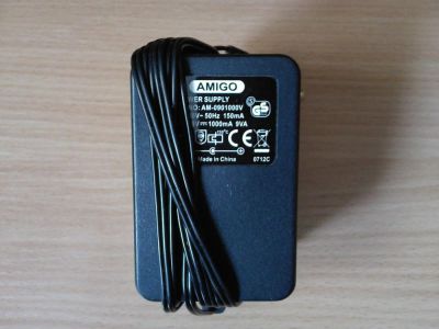 Лот: 8952093. Фото: 1. Блок питания AMIGO 9V/1A. Зарядные устройства, блоки питания для бытовой техники