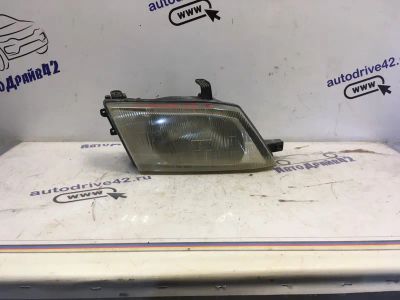 Лот: 21712671. Фото: 1. фара Nissan Wingroad Y11. Двигатель и элементы двигателя