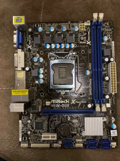 Лот: 15330492. Фото: 1. Материнская плата ASRock H61M-DGS. Материнские платы