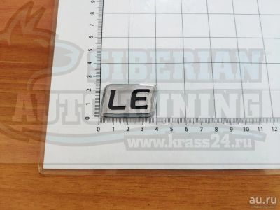 Лот: 13995249. Фото: 1. Шильдик с клеевой основой LE старый... Детали тюнинга