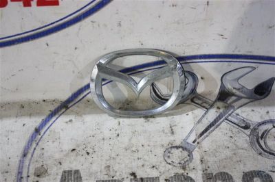 Лот: 21718373. Фото: 1. эмблема Mazda Demio DW3W. Двигатель и элементы двигателя