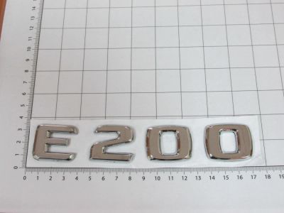 Лот: 10655680. Фото: 1. Эмблема шильдик E200 с клеевой... Детали тюнинга
