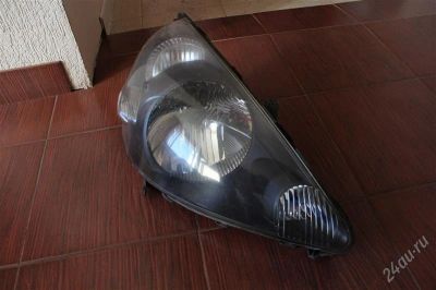 Лот: 2129379. Фото: 1. Оригинальная фара Honda Fit. Оптика и освещение
