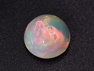Лот: 21055194. Фото: 1. Кабошон: 2.03 ct. Опал круг (Эфиопия... Драгоценные и поделочные камни